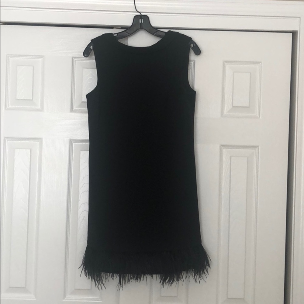 Black cocktail dress with feather detail